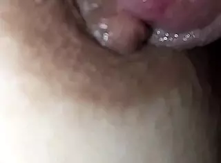 nipple covered in saliva, licking the glans