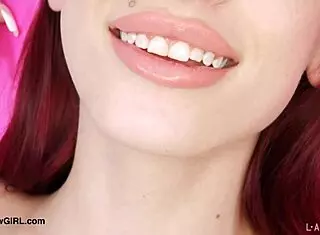 Red-haired model reveals her body in photoshoot.