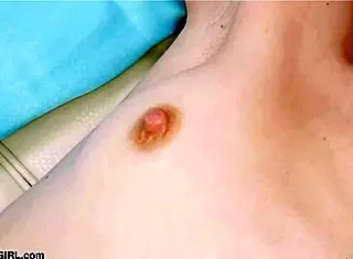 Red-haired model reveals her body in photoshoot.