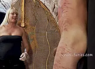 cruel blonde milf whipping guy's cock!