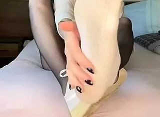 Blacknails feet in nylon fetish with nike airforce nylontights on girl
