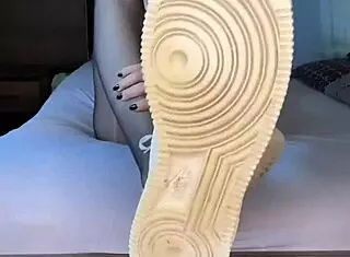 Blacknails feet in nylon fetish with nike airforce nylontights on girl