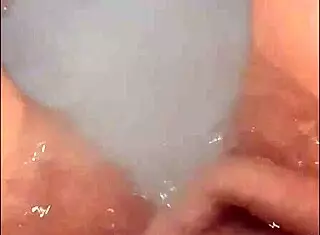 pretty woman masturbates in hot tub with bright loud cumshot watch to the end