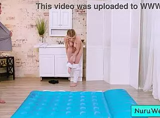 Pigtailed sexy blonde masseuse with big natural tits preps client for intense nuru massage session