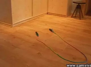 Topless redhead babe skips rope with big tits bouncing in stockings.