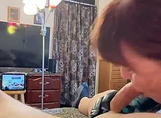 Granny locks eyes while giving a deep blowjob in this homemade mature scene.