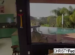 Attractive Performer Christy Mack Enjoys Her Impressive Assets on the Kitchen Counter