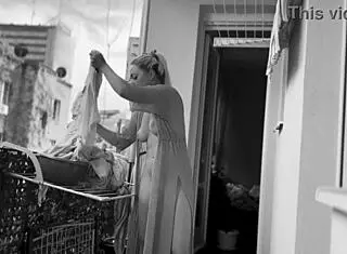 Whoa, this naked chubby woman is hanging out laundry on the balcony so neighbors can watch her big tits and shaved pussy flash 😲👀