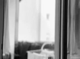 Whoa, this naked chubby woman is hanging out laundry on the balcony so neighbors can watch her big tits and shaved pussy flash 😲👀