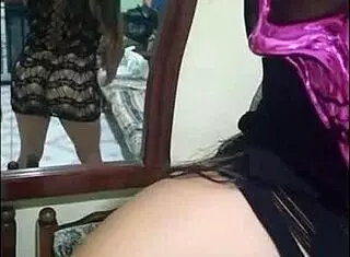 Delicious companion lady puts on a mask for halloween. She models erotically while groping her natural tits and touching her big pussy.