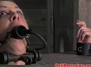 Bound Submissive Blonde Gagged with Ring by Dominant Master in Kinky Session