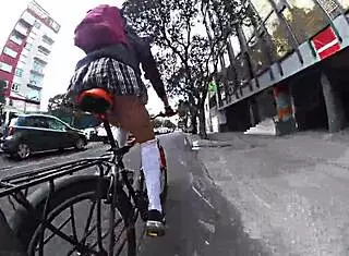 trans in minifalda exhibits upskirt on city streets with pigtails