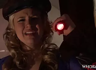 police officer engages in intense group encounter with masked figure at work