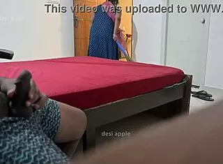 Maid flashing ass while giving handjob to owner