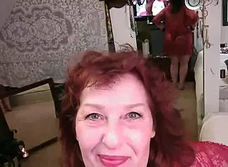 redhead mature dawnskye feels sexy in lingerie and fishnets