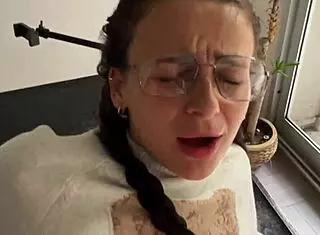 spanish teacher takes control on the desk with petite brunette student during class