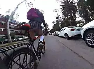 trans in minifalda exhibits upskirt on city streets with pigtails