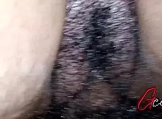 Intimate close-up moment featuring natural hairy textures and creamy details