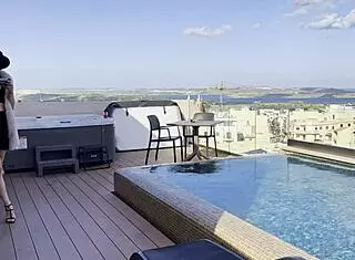 Daisy takes to the skies as a pilot, flashing her assets in a solo pool dance session. She teases with dirty talk and ass worship.