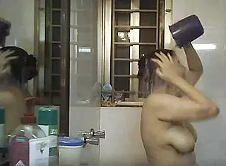 Voyeur spies on Indian bbw with big natural tits and fat curves in shower.