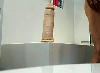 Huge dildo stretches tight hole in solo play