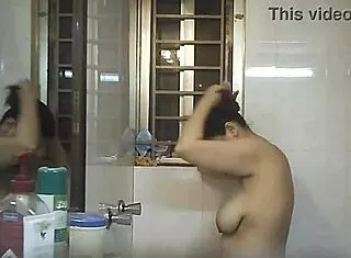 Voyeur spies on Indian bbw with big natural tits and fat curves in shower.