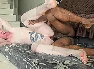 Swollen pink ass from intense anal with massive black cock leading to creampie explosion.