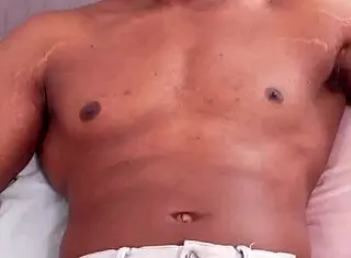 Big muscular bodybuilder shows off monster big black cock