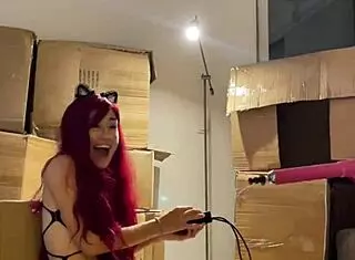 i'm a red haired teen beauty dancing sexy striptease and preparing sex machine with dildo in mouth