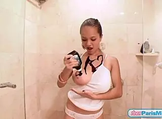 This chocolate-covered teen Paris Milan starts with a steamy shower, undressing slowly. She teases with her big tits and petite body in a French-Colombian style.