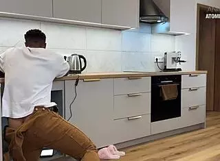 oh wow, that slutty wife is getting fucked hard by the black plumber's huge cock in the kitchen! 🔥🍆