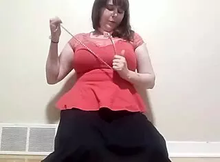 Whore teases with leash on big nipples and clit clamps while fucking huge dildo