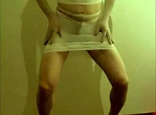 crossdresser maria struts in white nylon pantyhose and high heels, showing off skirt, shorts, dress, feet, pantyhose, shoes, panties, stockings, leggings, miniskirt, and see-through nylon layers casually