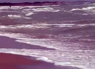 Gorgeous teen Agnes with big tits and cute ass bathes naked body in ocean outdoors