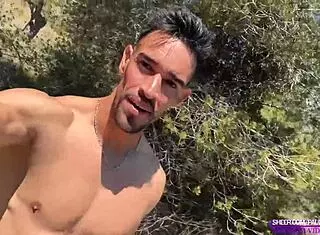 Muscular stud masturbates big cock naked on public trail
