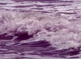 Gorgeous teen Agnes with big tits and cute ass bathes naked body in ocean outdoors