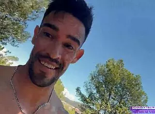 Muscular stud masturbates big cock naked on public trail