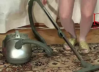 Maid Regina Noir cleans the apartment and dances with a vacuum cleaner. Is that teasing in her stockings and panties? 279 07 1
