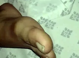 pack night four unfolds with amateur fetish feet play on bed in bedroom.
