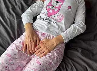 teen in pajamas fingers her shaved pussy to squirt then takes cumshot from a huge cock