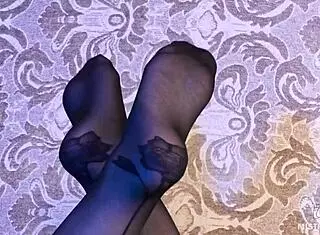 I tease you with my feet in black pantyhose and rose print heels goddess style