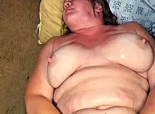 Man pissing on submissive whore with big tits