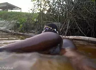 Skinny Dark Skinned African Hottie Teases Solo With Tits In The Water Showing Softcore Moves