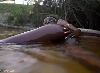 Skinny Dark Skinned African Hottie Teases Solo With Tits In The Water Showing Softcore Moves