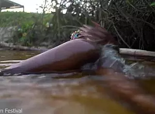 Skinny Dark Skinned African Hottie Teases Solo With Tits In The Water Showing Softcore Moves