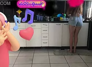 Young sexy skinny Brazilian Sol Megan Fire dances while tidying up the kitchen homemade style.
