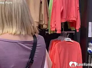 My girlfriend drops to her knees for a blowjob in the changing booth