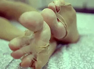 Sexy blonde teases with feet in nylons craving cum while spitting and dominating in barefoot femdom fetish