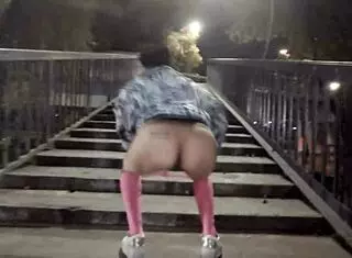 Casual stroll in a thong contrasts with public outdoor exposure in Mexican setting