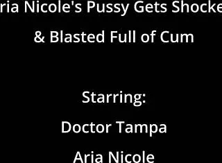 Aria Nicole's petite pussy spreads close up during orgasm with cum blast and moaning in latex gloves behind scenes.